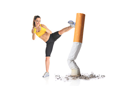 Girl kicking a cigarette butt