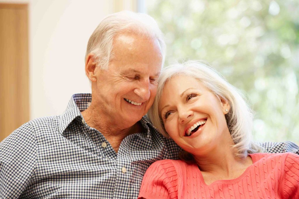 Senior man and daughter at home